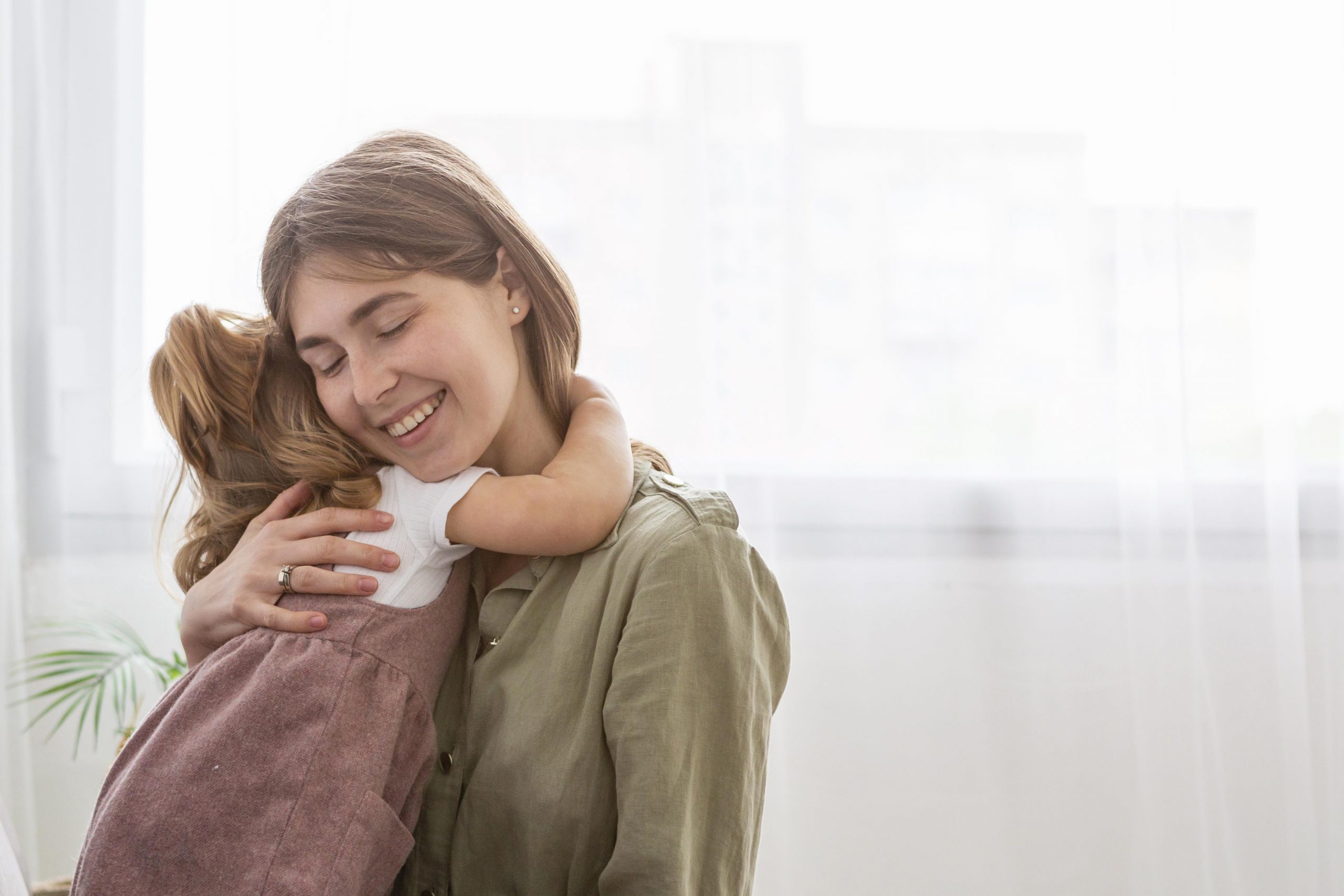 happy-mother-hugging-daughter